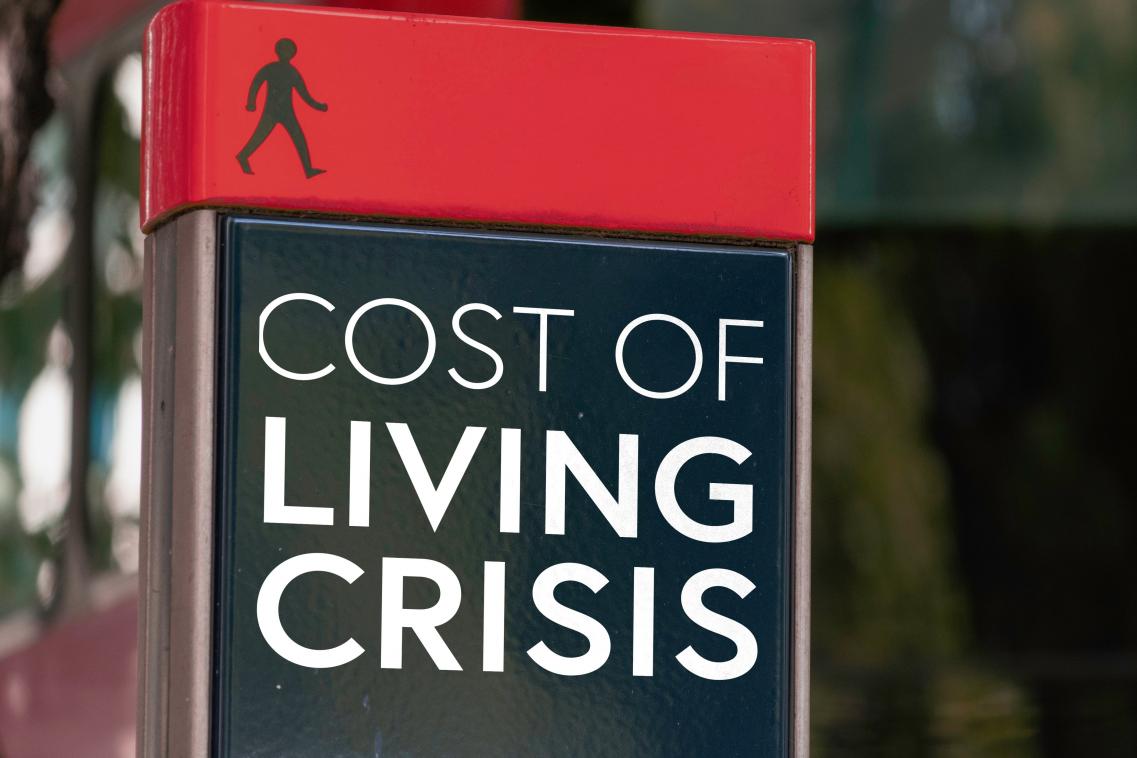Signpost saying COST OF LIVING CRISIS