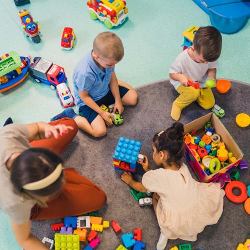 Children playing with bricks in a sure start centre