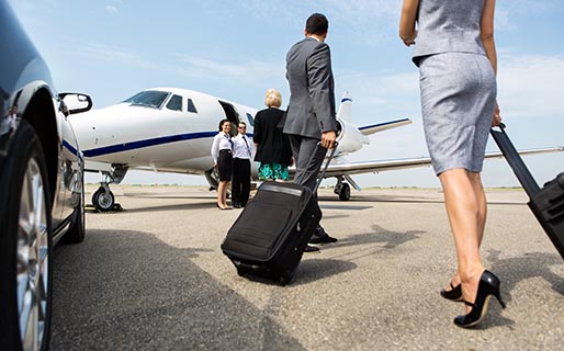 Business Partners Walking Towards Private Jet