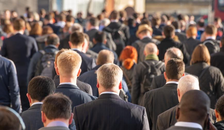 An image of commuters walking to work