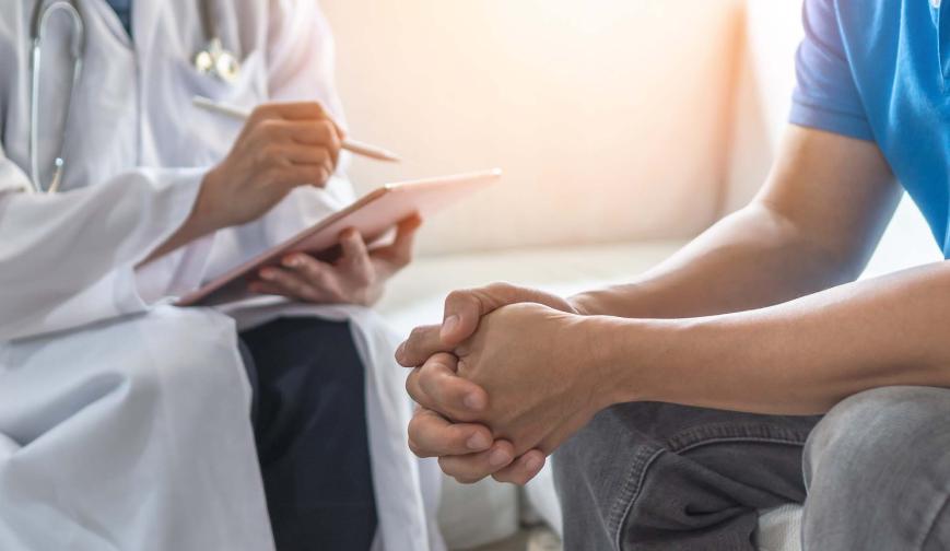 Doctor speaks to patient
