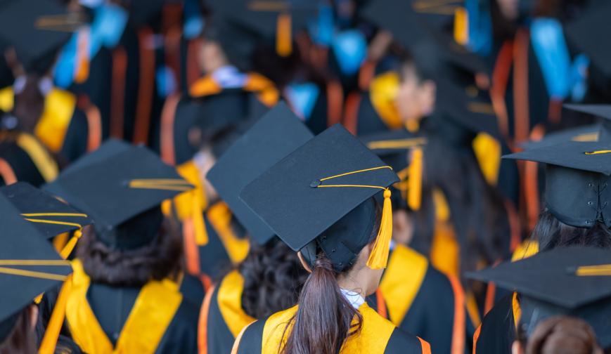 An image of students dressed for graduation