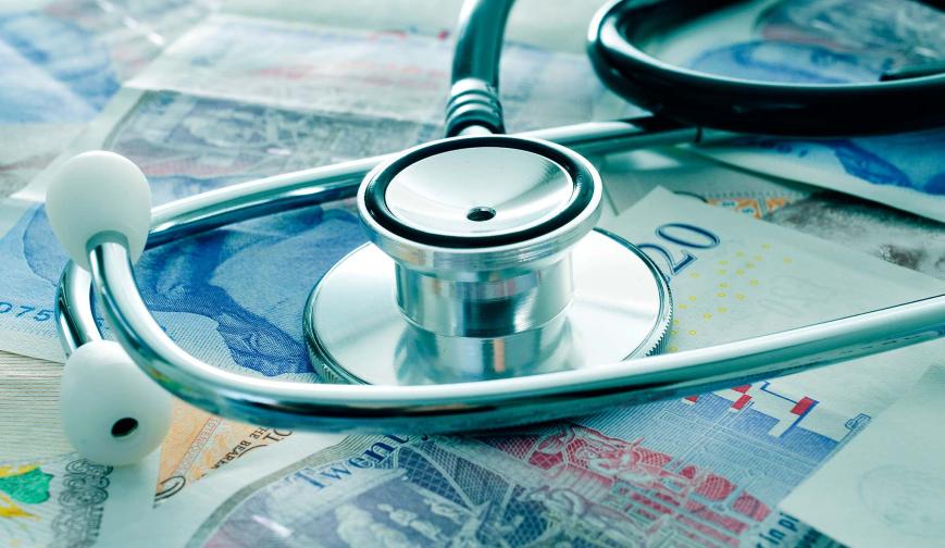 Stethoscope on money