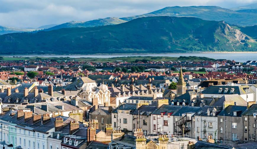 Welsh town with mountains behind