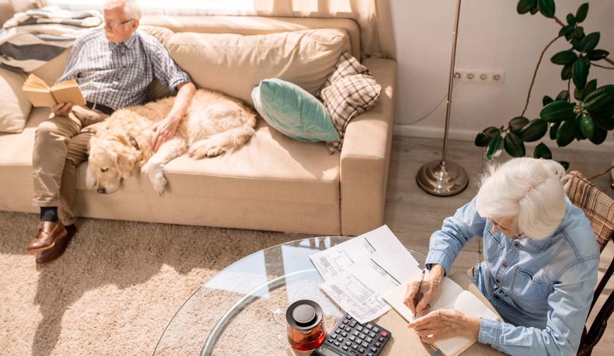 Elderly couple looking at paperwork
