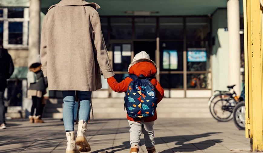 Child and mother holding hands