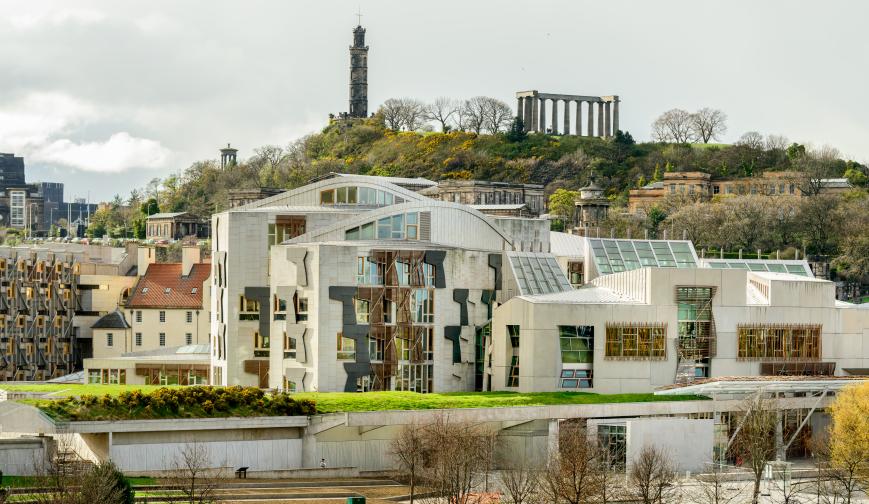 Image of the Scottish Parliament building with Calton Hill behind