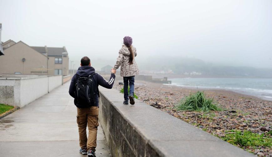 father and daughter rainy day