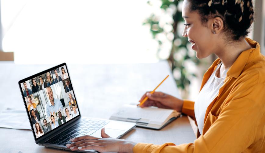 Image of woman working on her laptop joining an online training course 