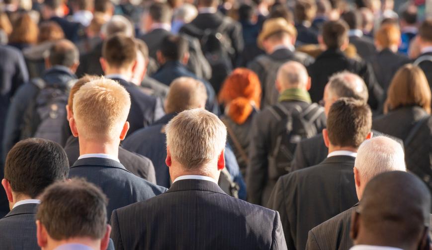 Crowd of people wearing suits