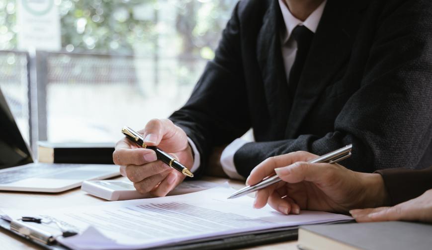 Person making notes in a meeting