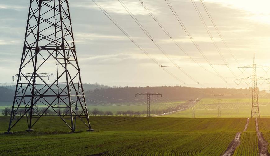 Electricity pylons across a field