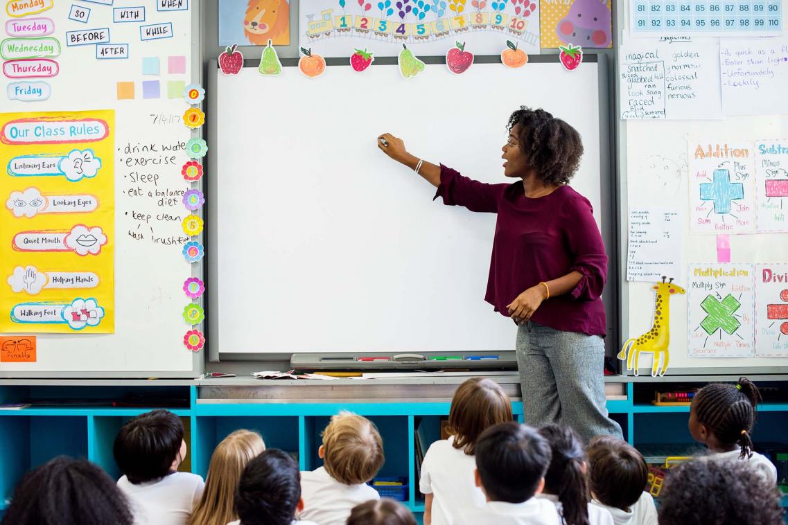 Teacher and whiteboard