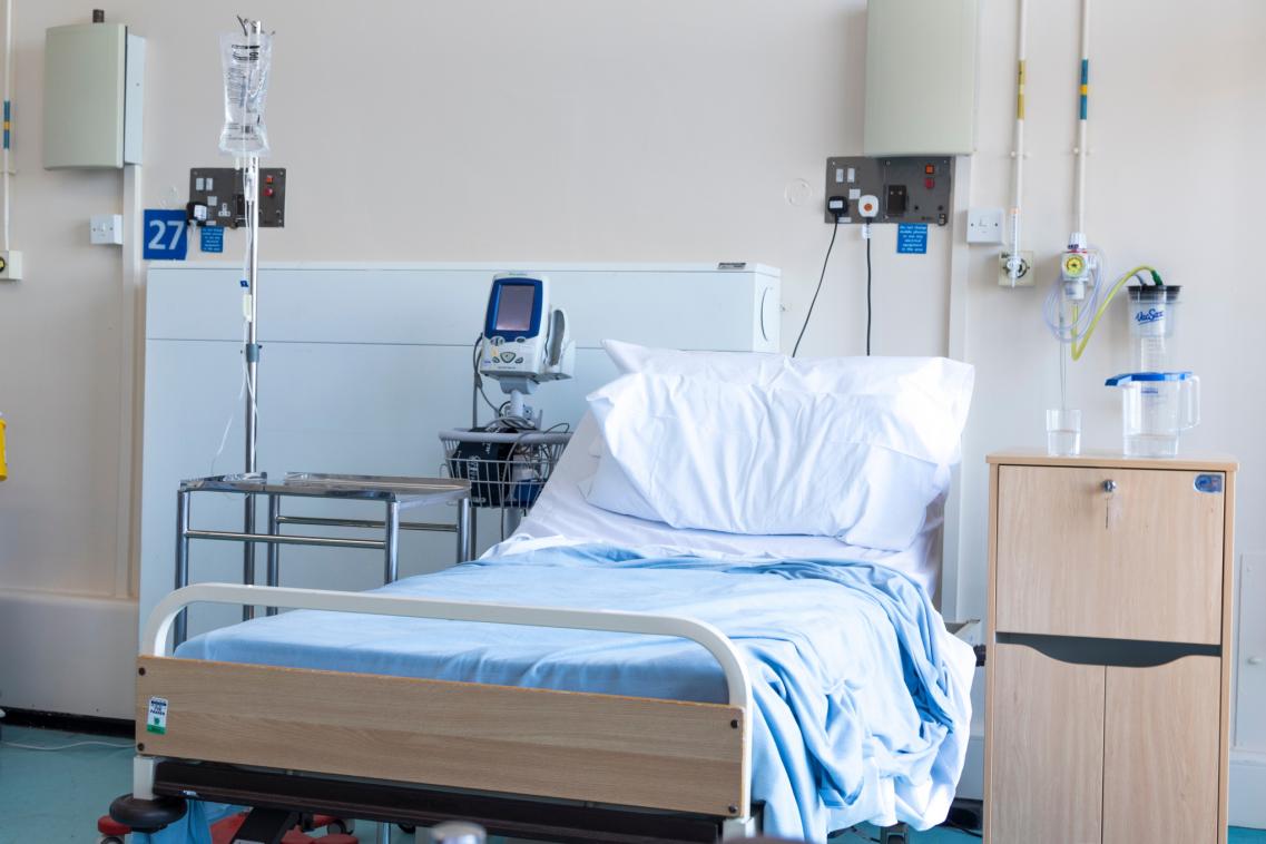 An image of an empty hospital bed