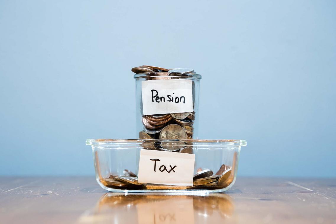 Jars with cash inside labelled tax and pension