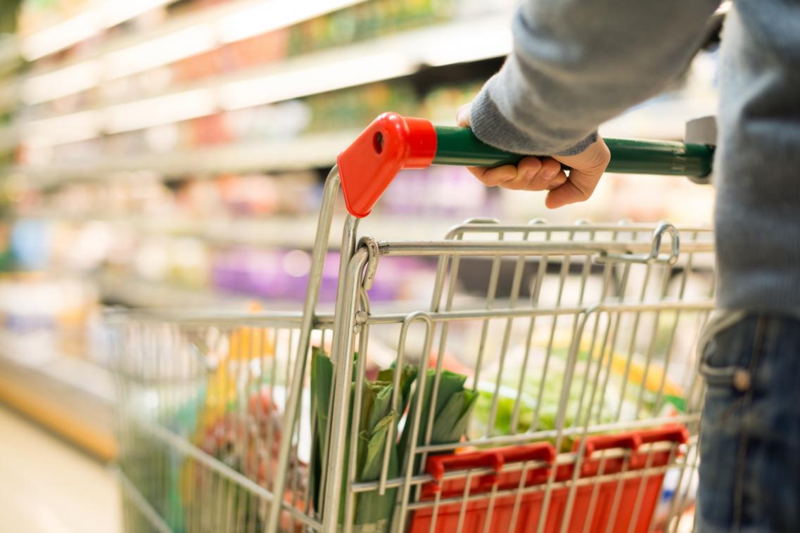 An image of a person pushing a shopping trolley