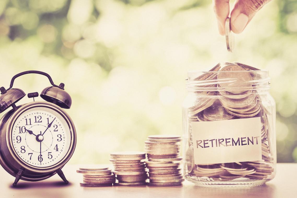 A jar of coins and an alarm clock