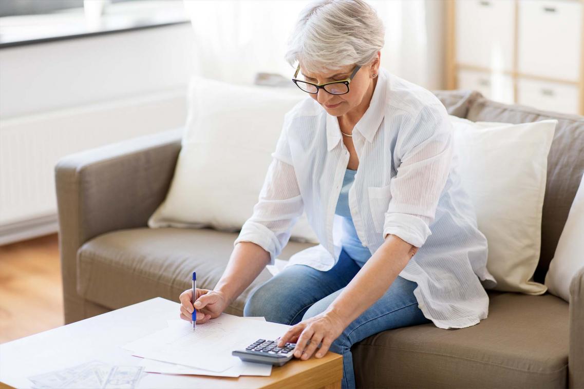 Woman using calculator