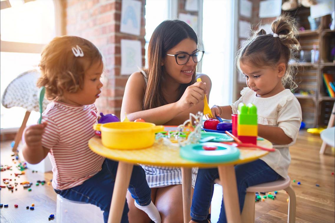 Woman at early years school with children