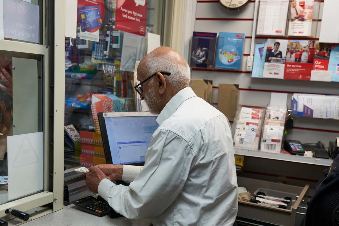 Older worker in post office