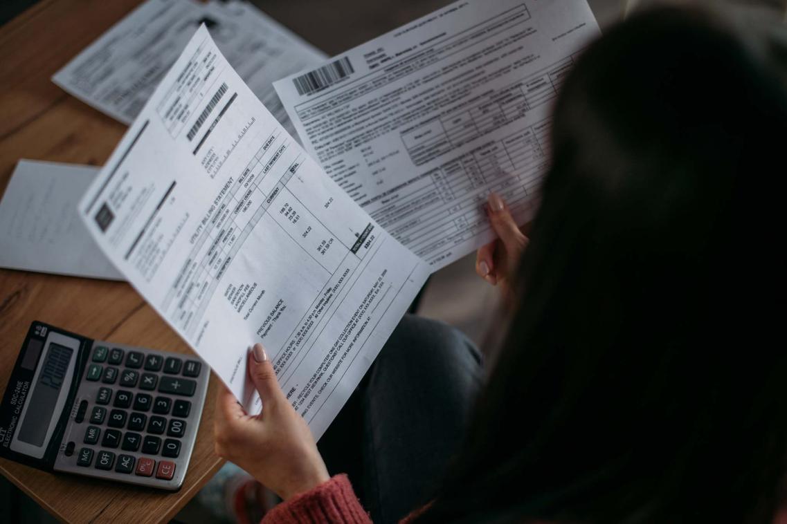 Women looking at bills