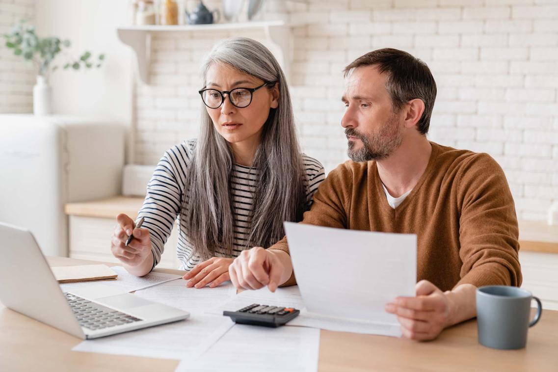 Couple looking at financial arrangements