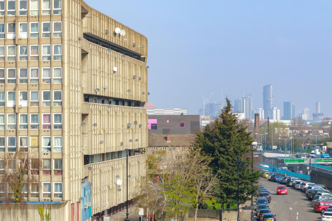An image of a block of flats with the City in the distance