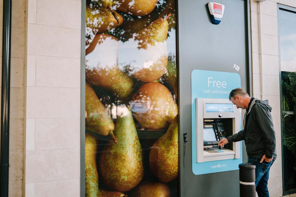 Man withdraws money from ATM