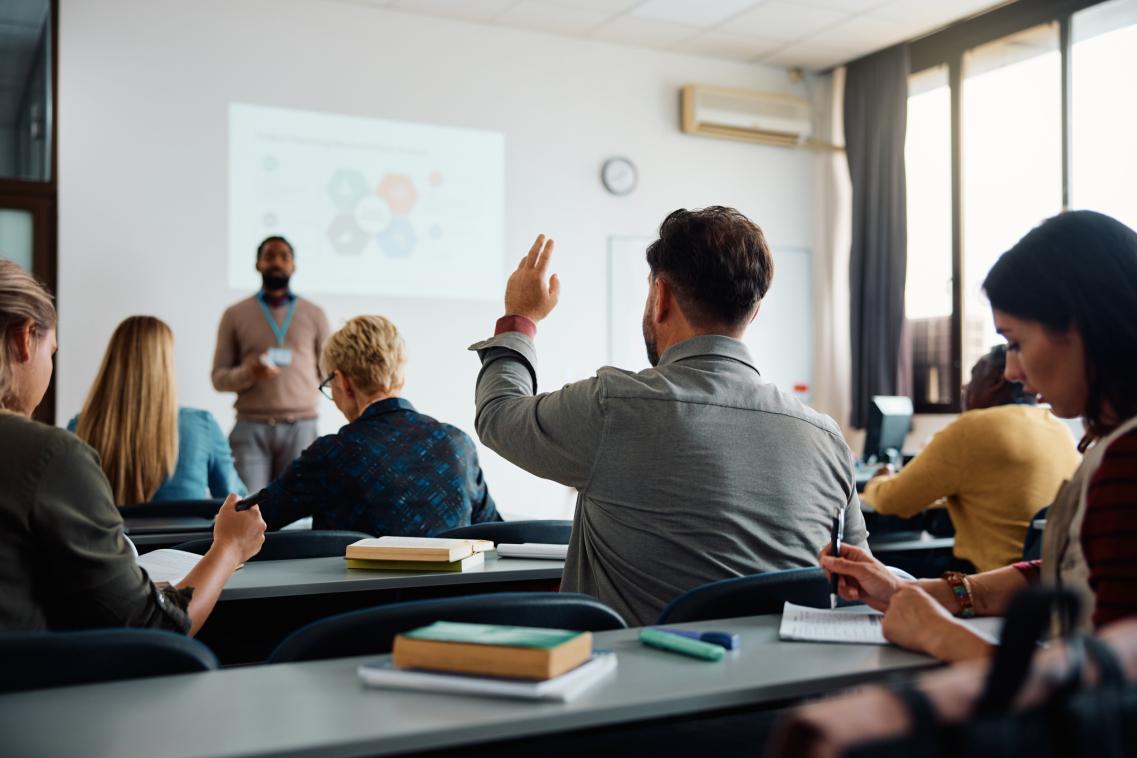 A photo of adults in a classroom