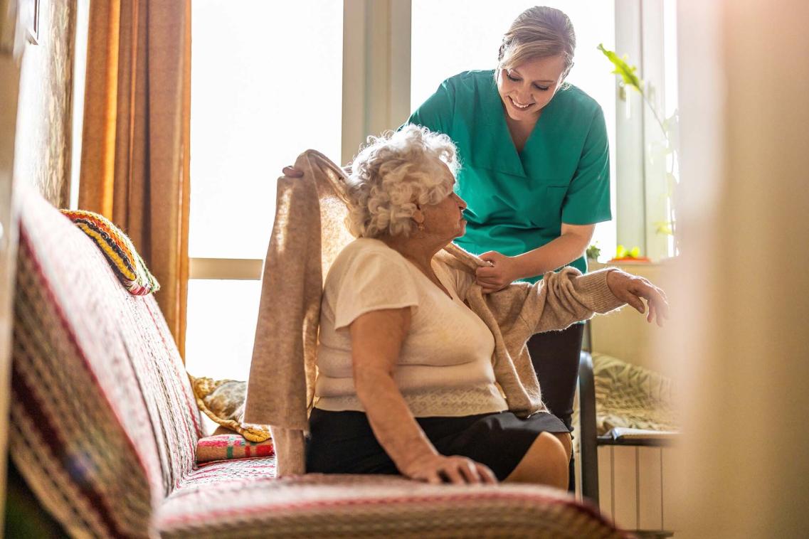 Social care worker with elderly patient