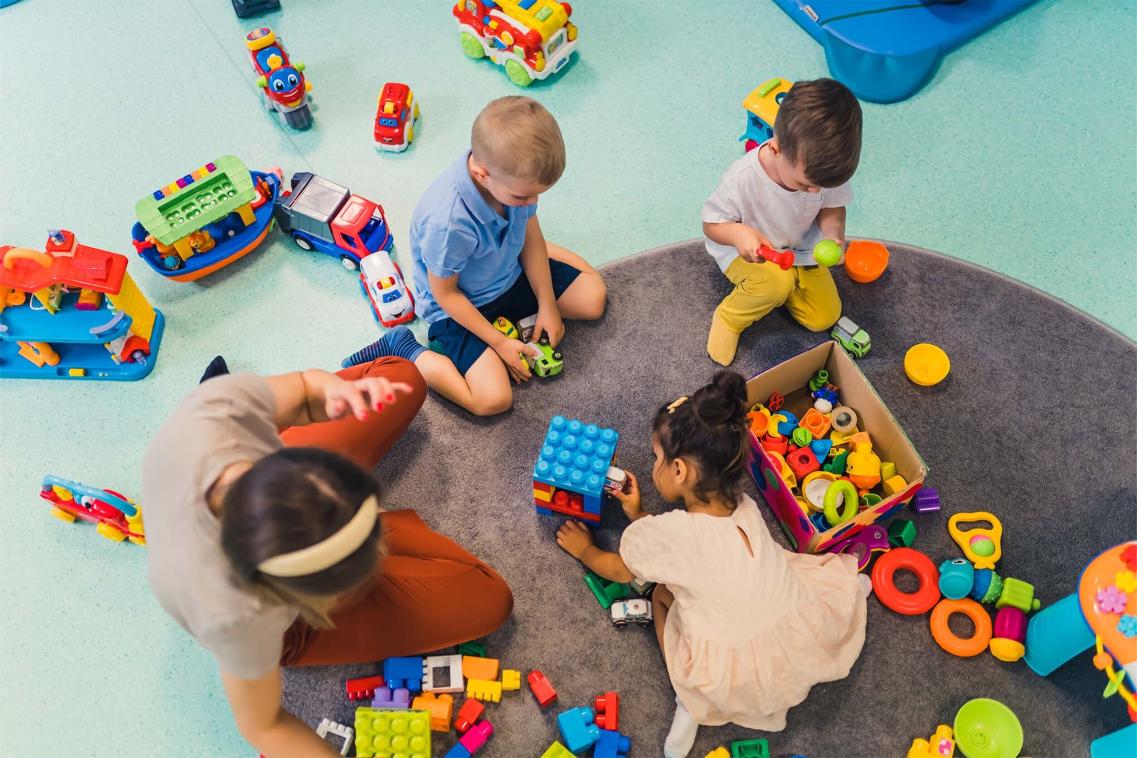 Children playing with bricks in a sure start centre