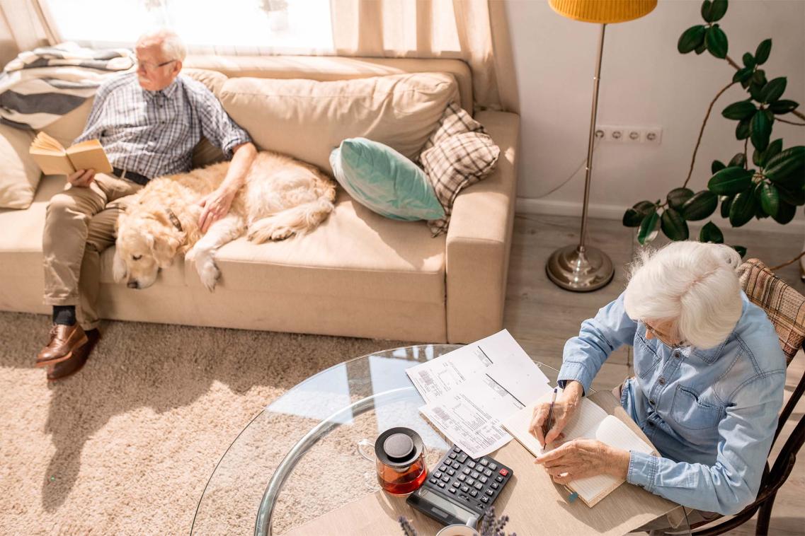 Elderly couple looking at paperwork