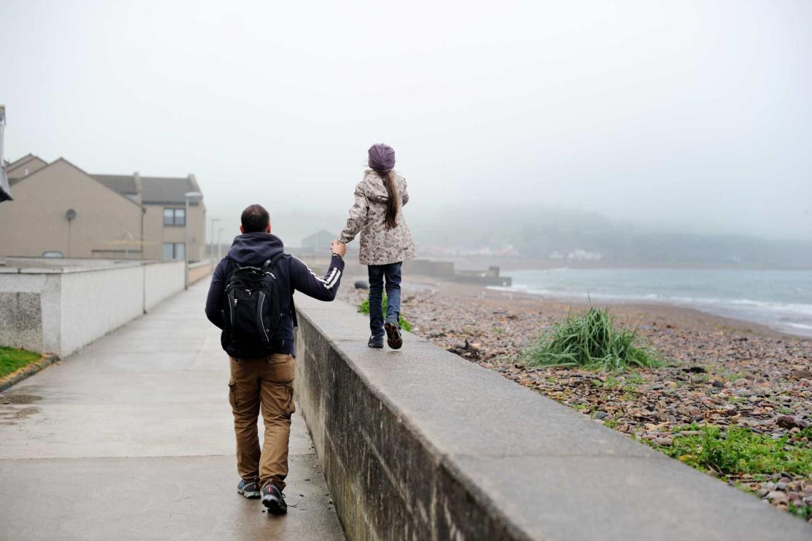 father and daughter rainy day