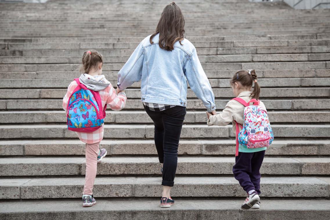 Mother walking with children