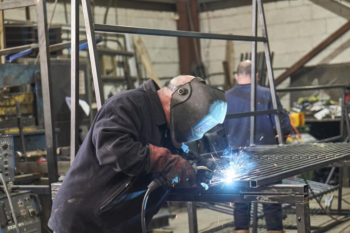 Photo of man welding