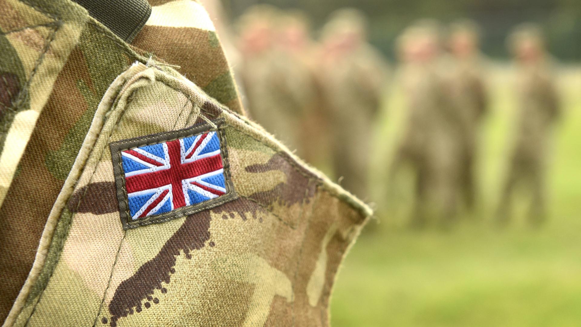 Soldier with UK flag on clothes