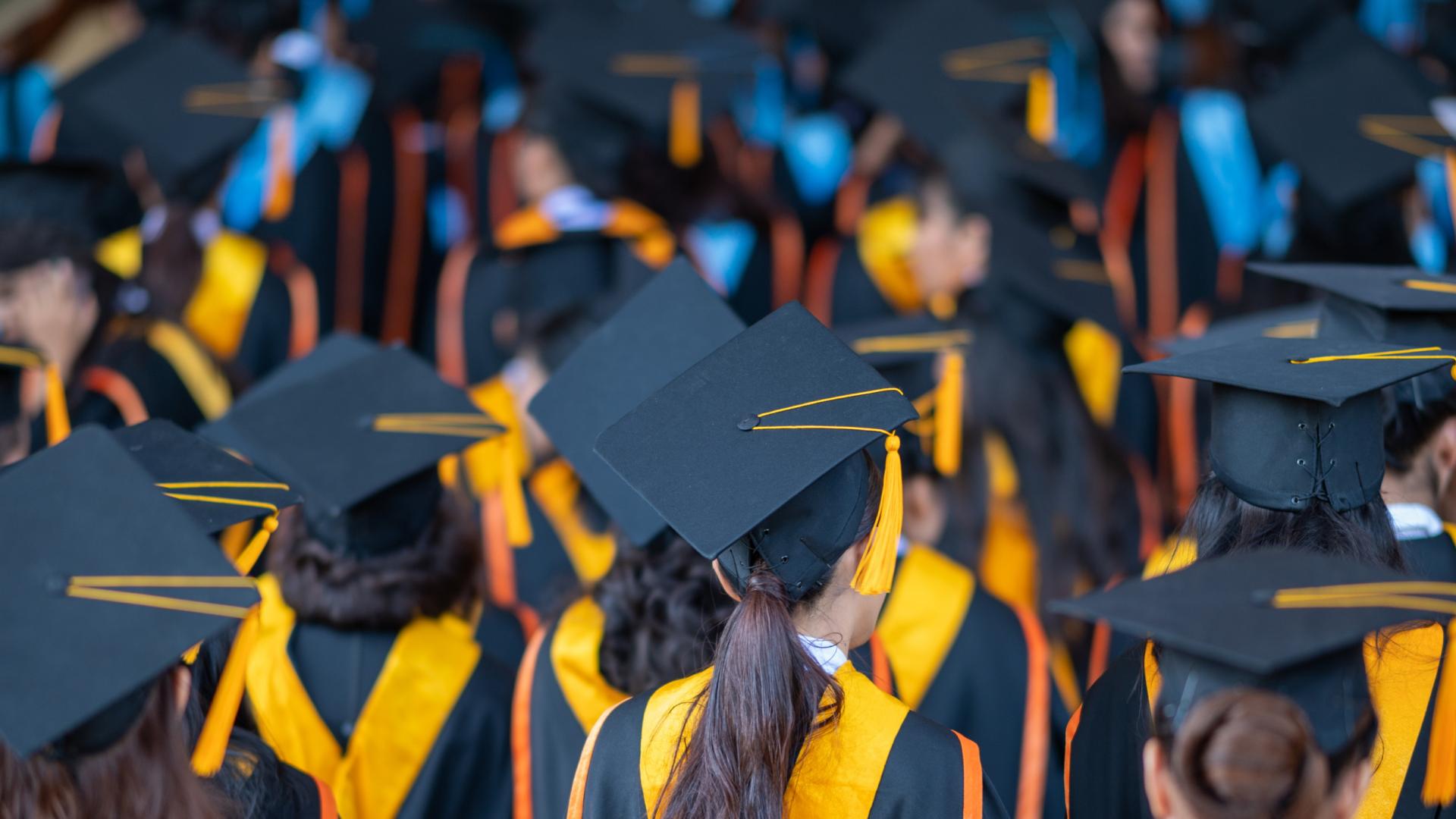 An image of students dressed for graduation