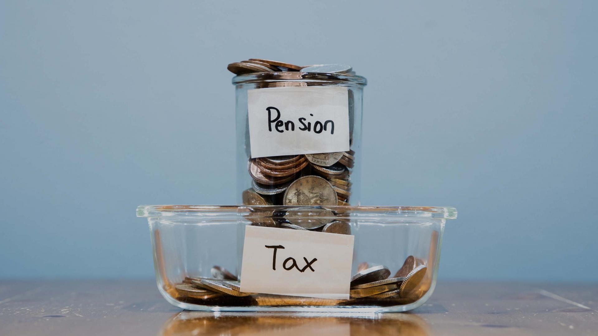 Jars with cash inside labelled tax and pension
