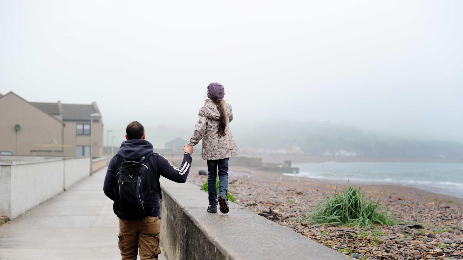 father and daughter rainy day