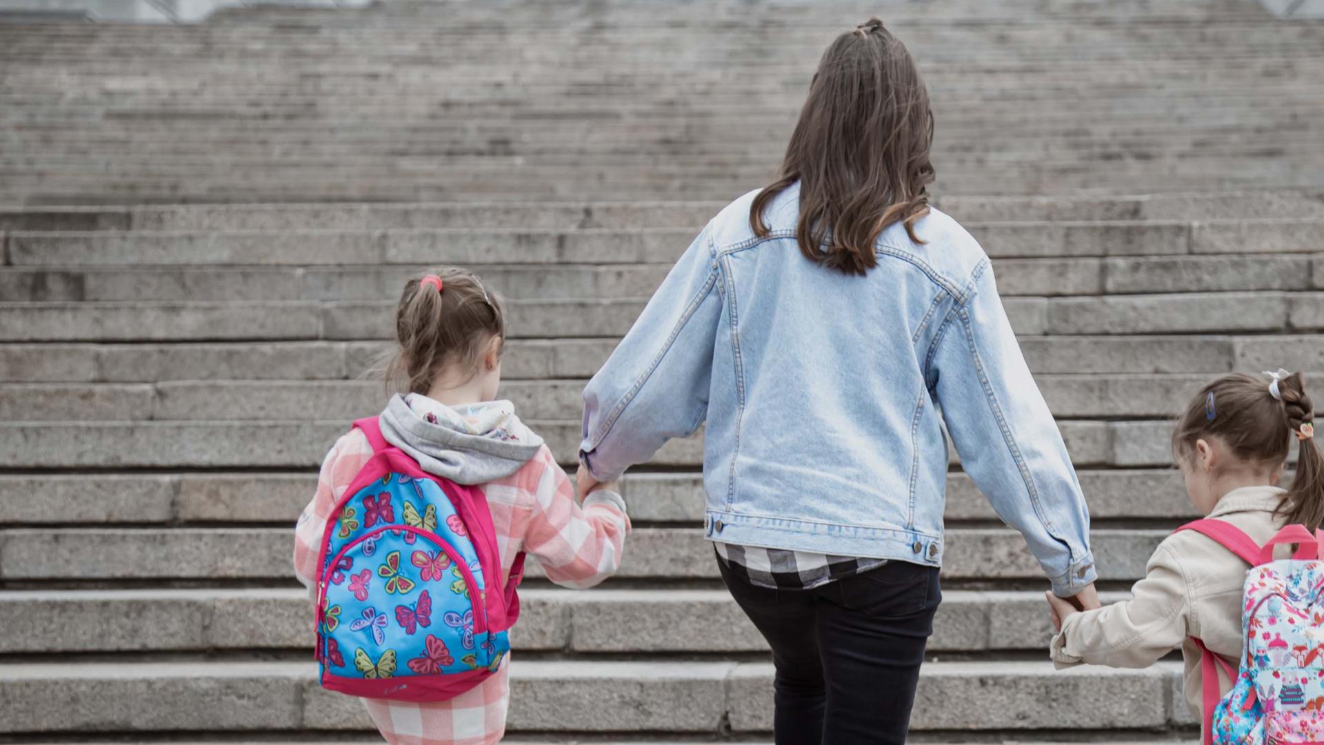 Mother walking with children