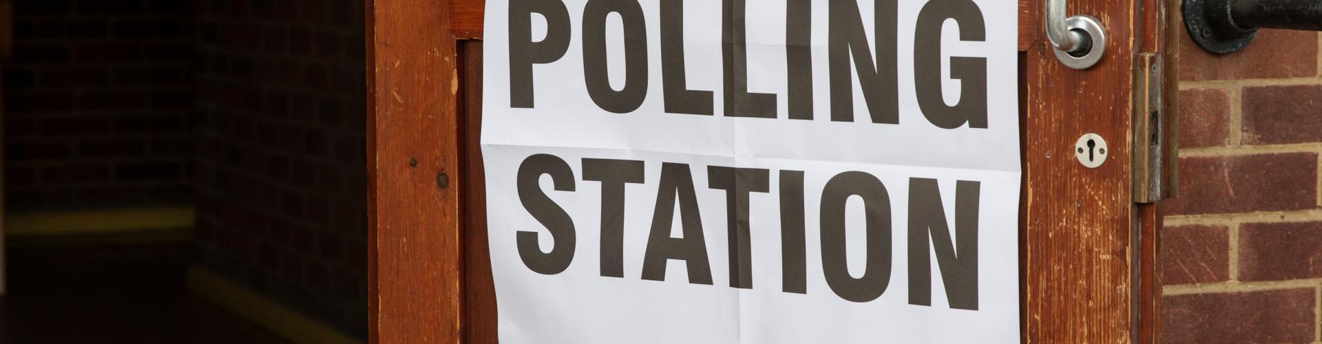 Polling station sign on a door