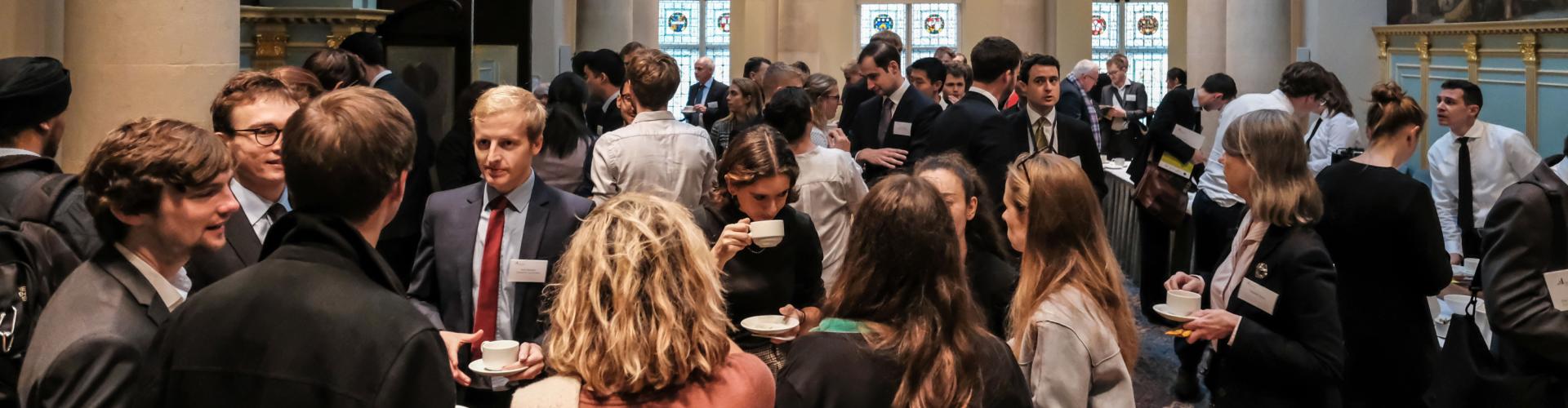 An image of people networking at an event
