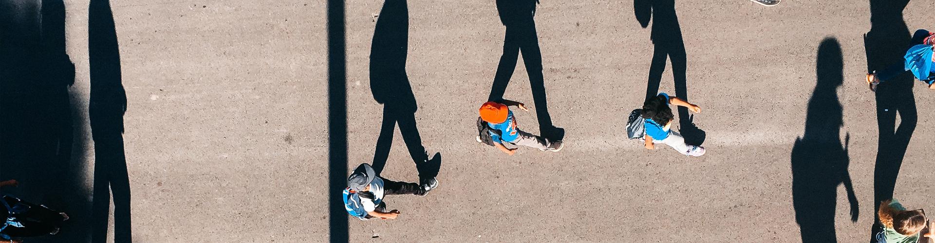 Shadows of people walking