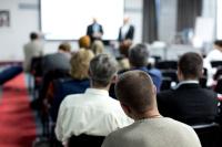 An image of adults at a lecture