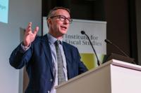 An image of Paul Johnson presenting at an event