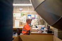 Older worker in a storeroom