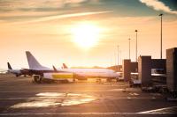 Image of airplane on tarmac at sunset 