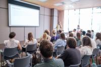 Image of speaker presenting a workshop
