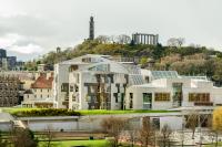 Image of the Scottish Parliament building with Calton Hill behind