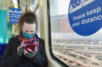 female passenger wearing face covering mask during covid-19 lockdown